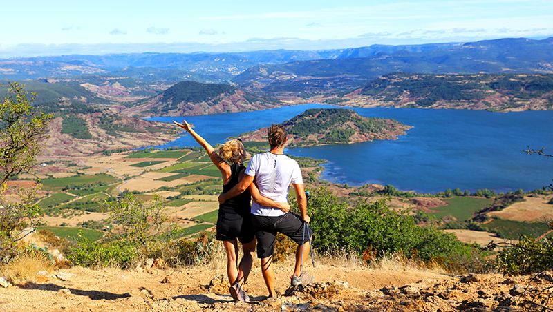 a picture of a couple on a mountain side.