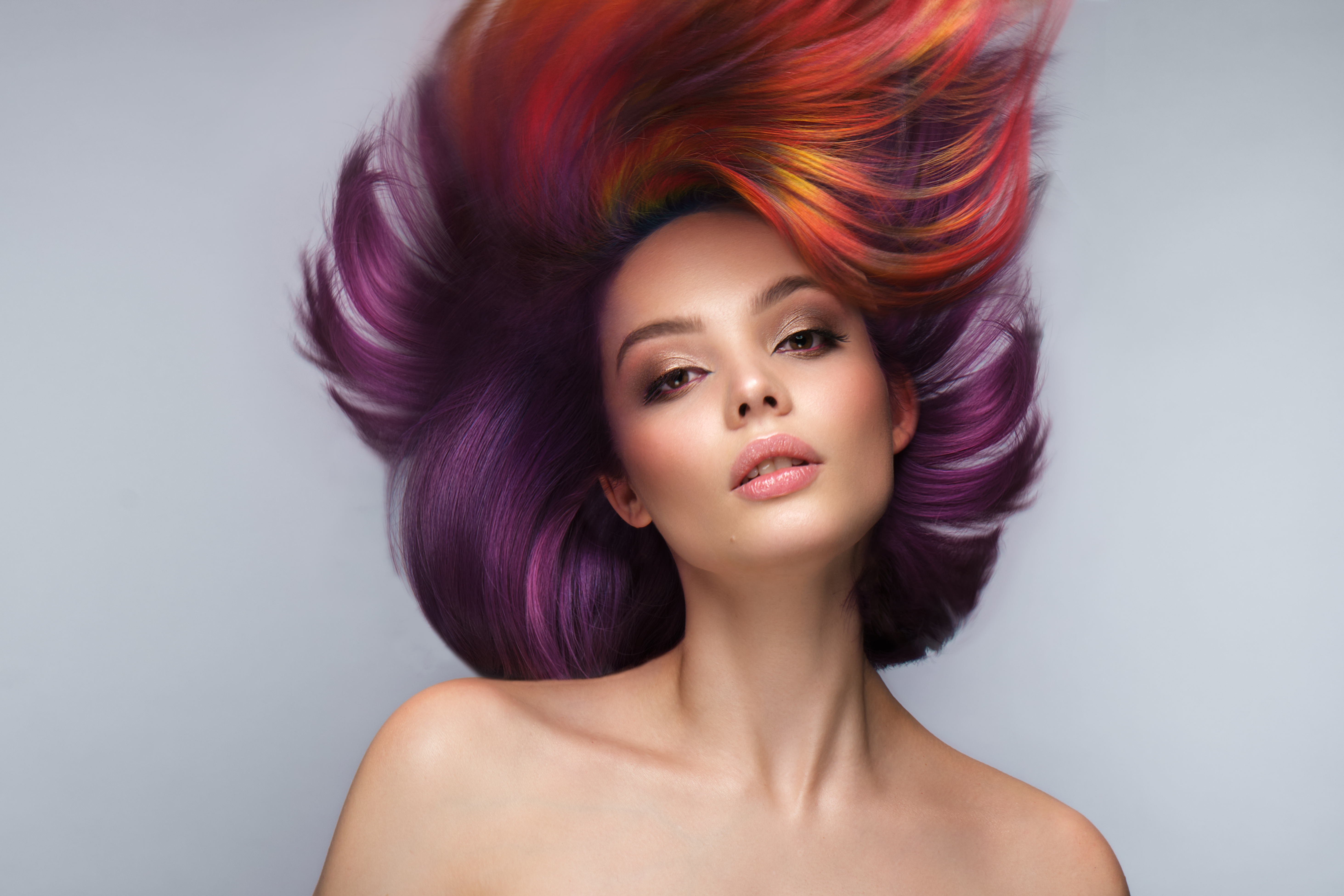 Woman with styled hair wearing coloured contact lenses