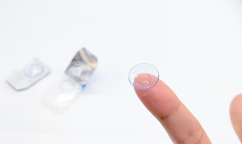 a picture of a contact lens on a finger