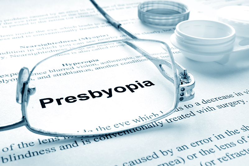 The word presbyopia through eye glasses.