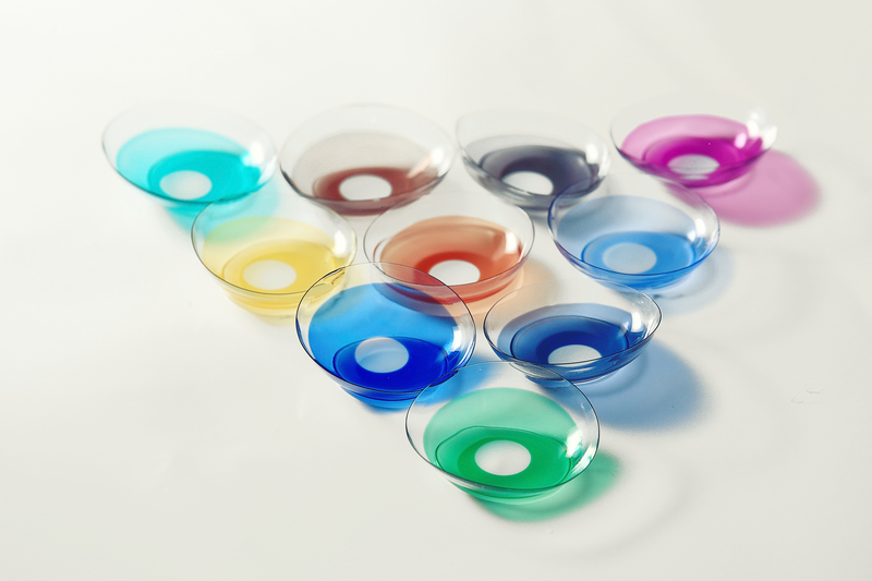 loose assorted colour contact lenses arranged as inverted triangle