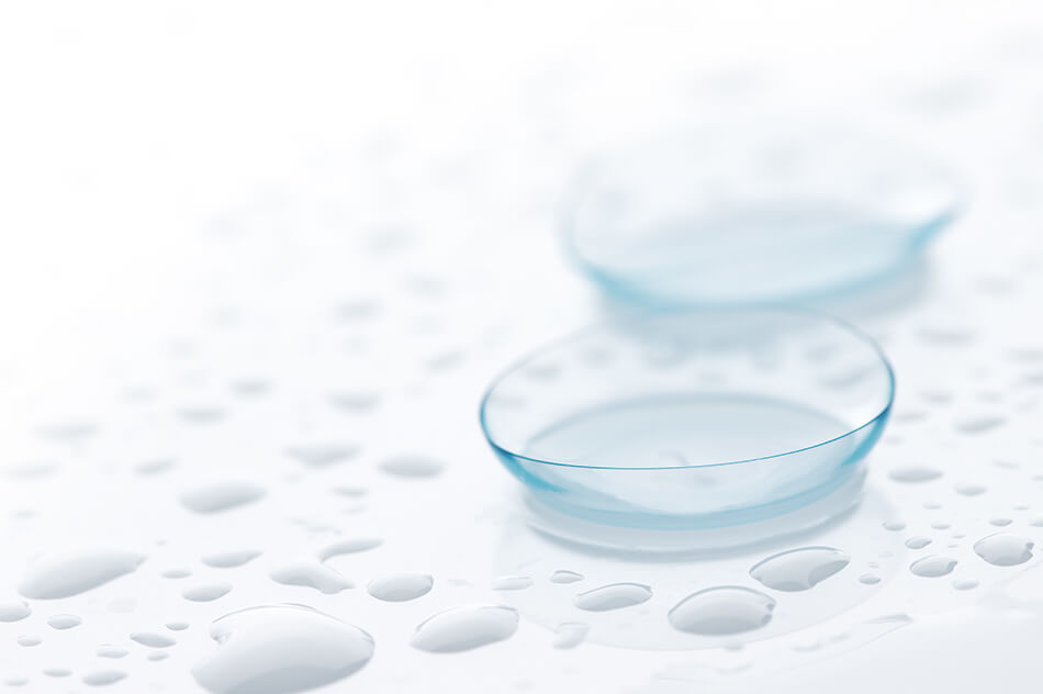 illustration of small contact lenses close up white table