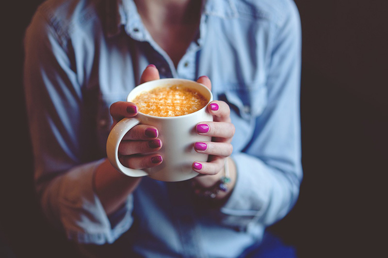 an Image of a woman drinking coffee