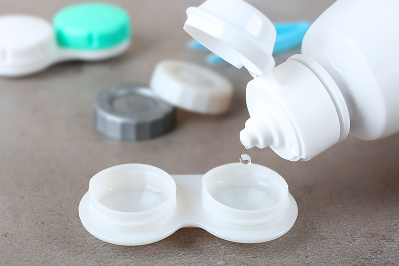 Contact lens solution being poured into a contact lens case